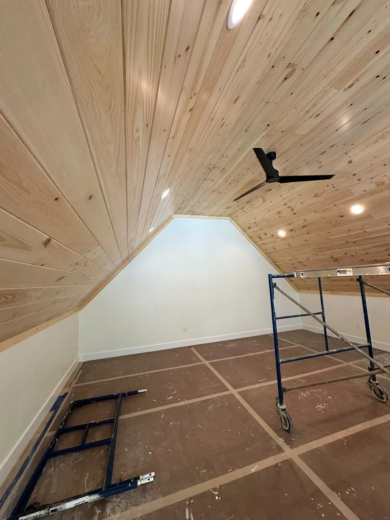 Finished pine ceiling with ceiling fan