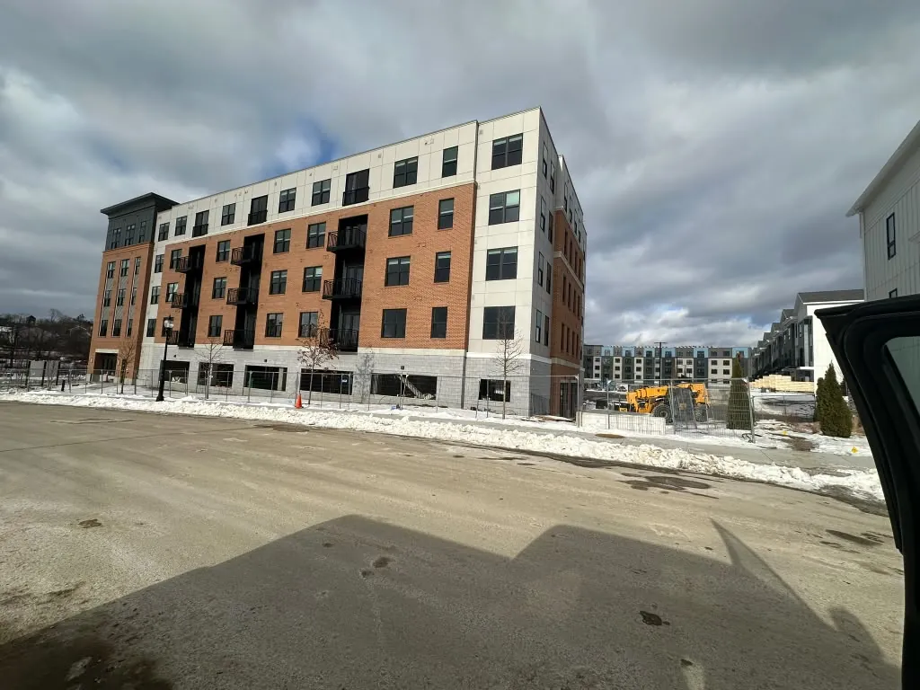 Apartment building with brick and panel exterior