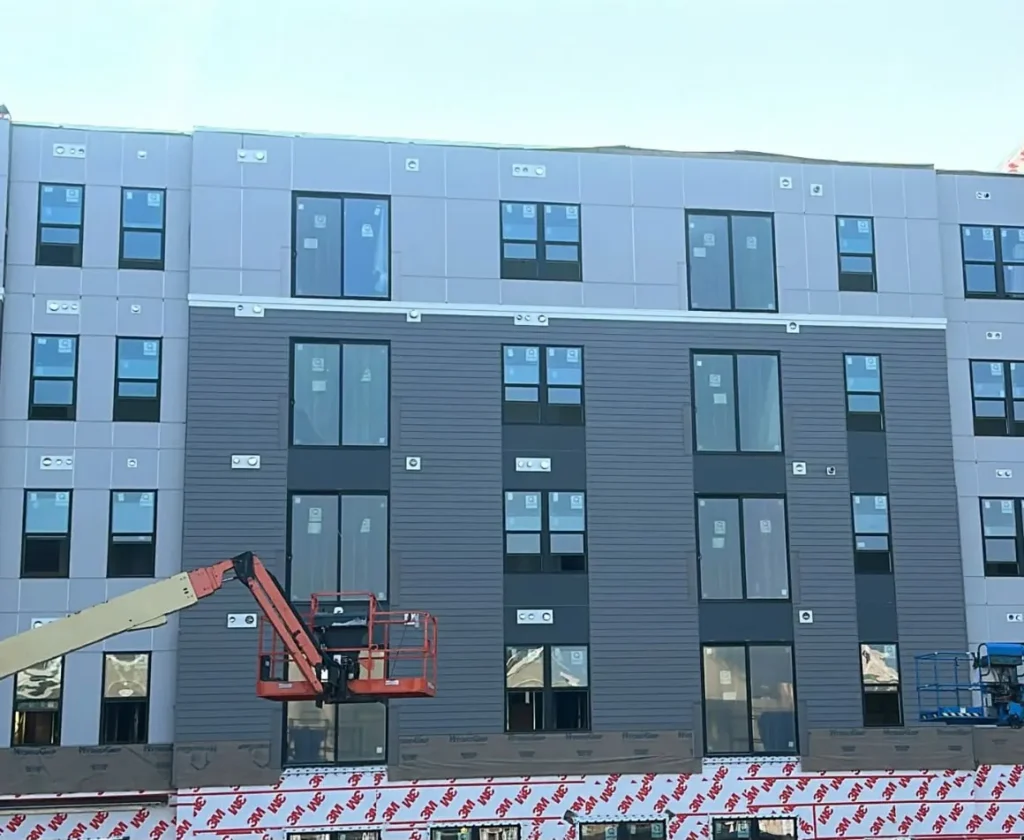 Panel installation on apartment building
