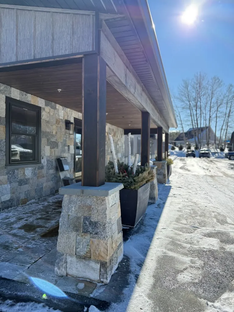 Stone-based porch columns with timber beam